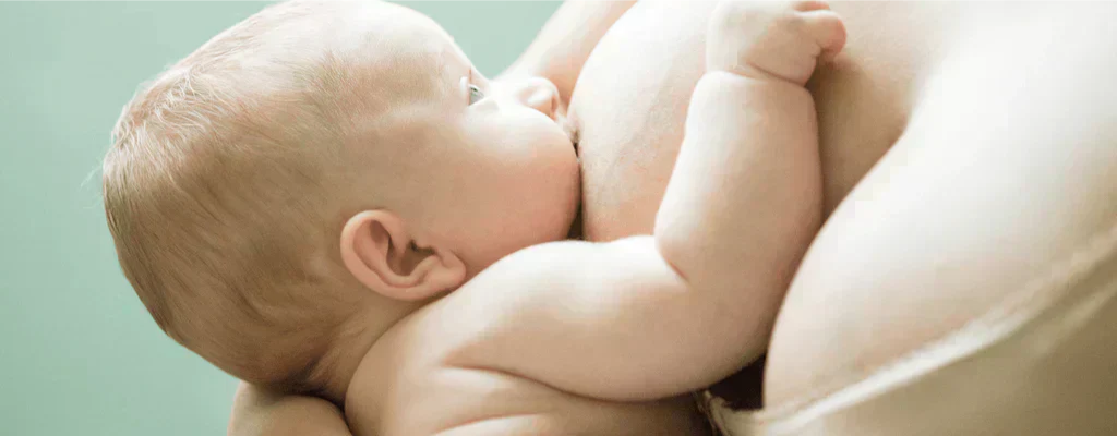 mother breastfeeding newborn