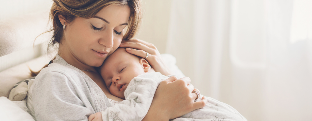 postpartum mum holding baby