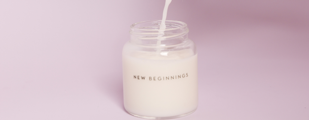 pouring breastmilk into baby bottle