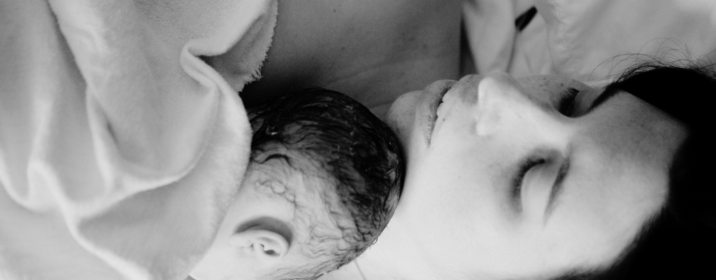mother holding baby after giving birth