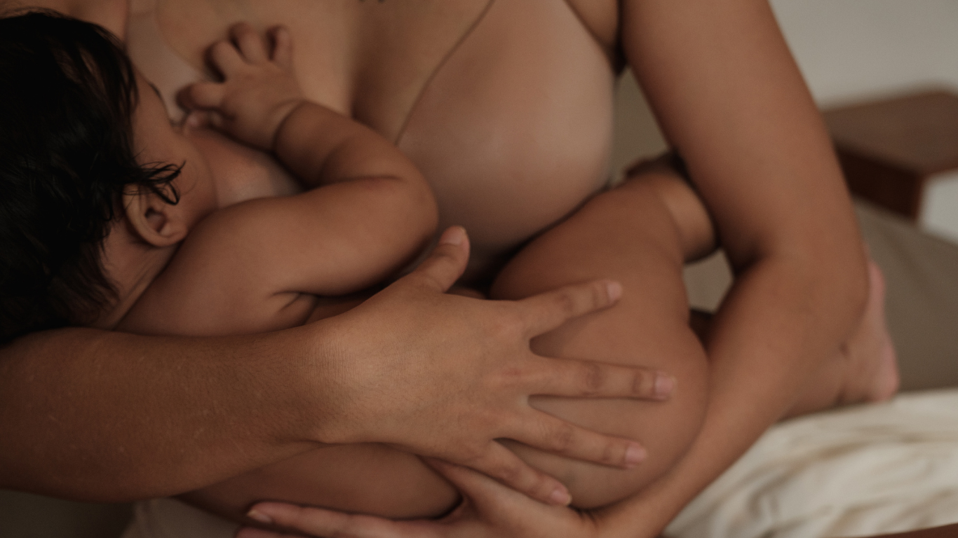 postpartum mum feeding baby