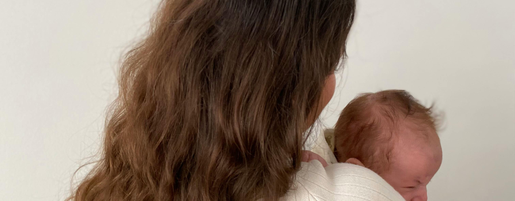 postpartum mother holding baby