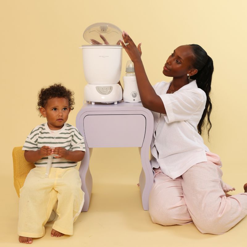 mother using steam steriliser