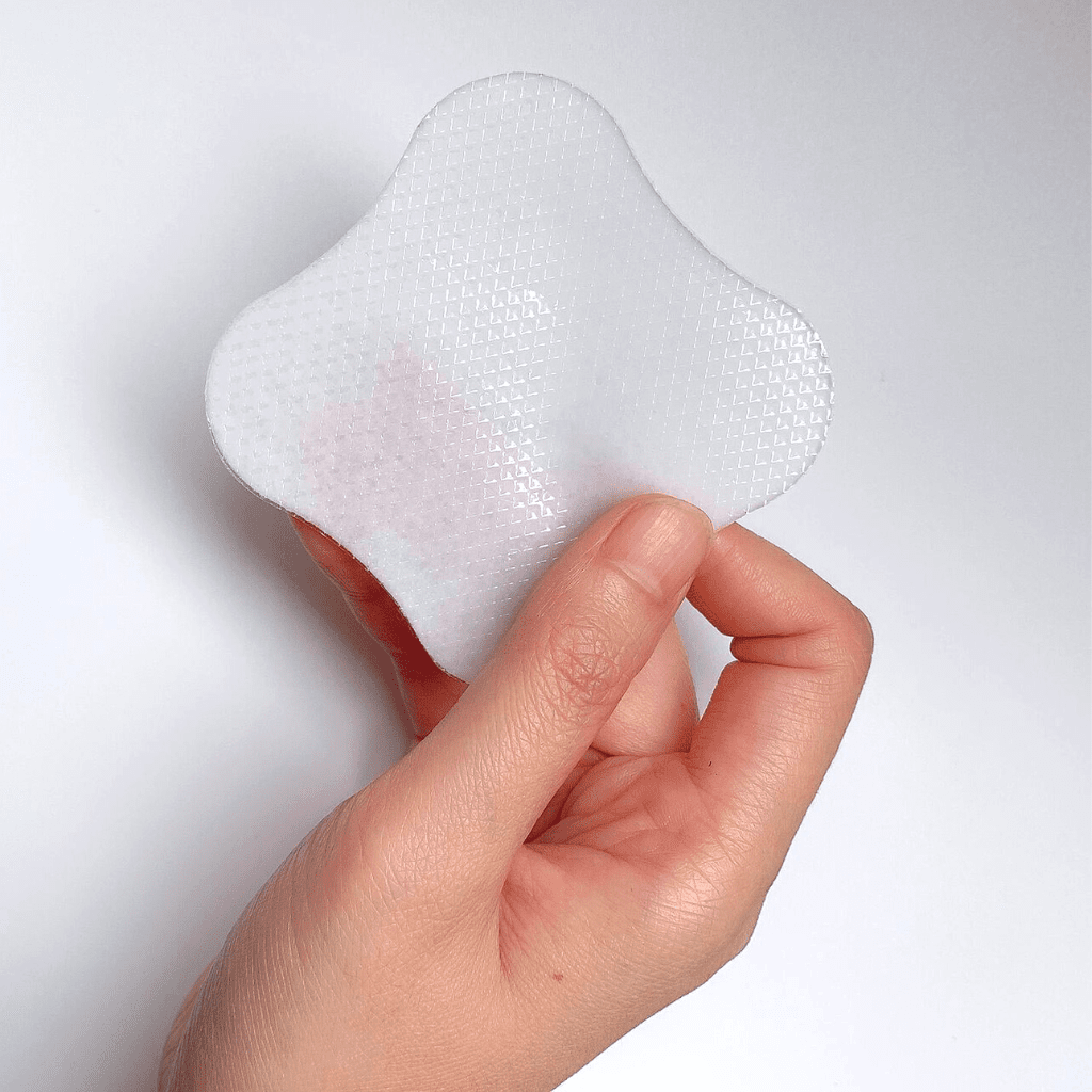 woman holding cooling Gel Breast Pads 16pk