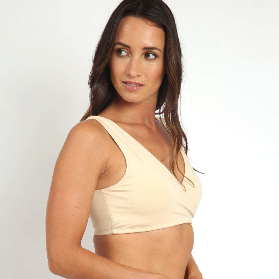model wearing transition maternity bra in yellow