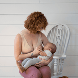 mother wearing a transition maternity bra and feeding baby